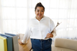 Counselor with clipboard in office