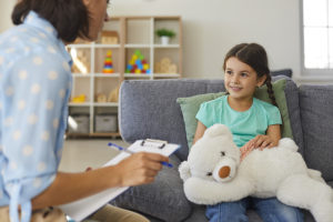 A counselor and a child in a counseling session