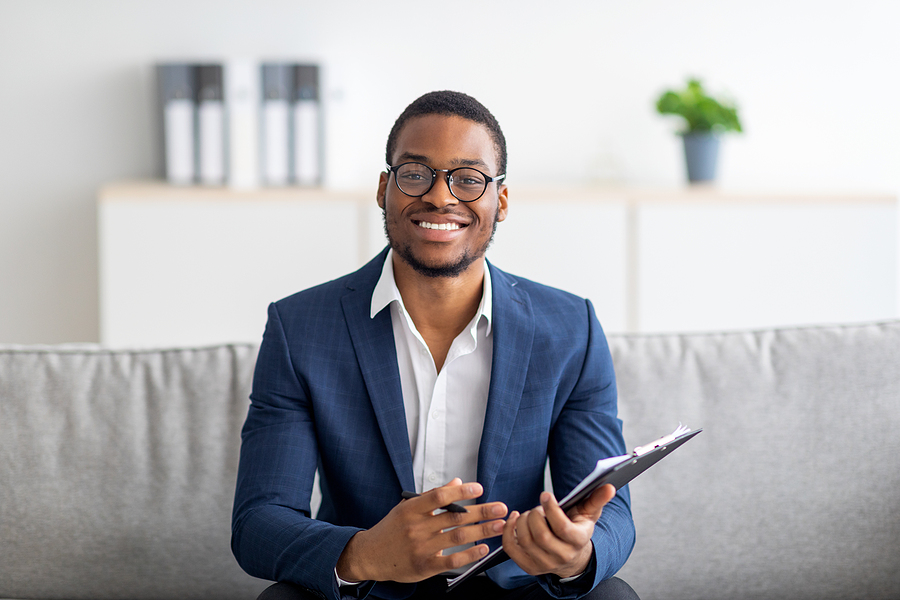 African-American male therapist in office.