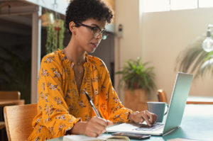 Student on laptop working on a graduate certificate in psychology