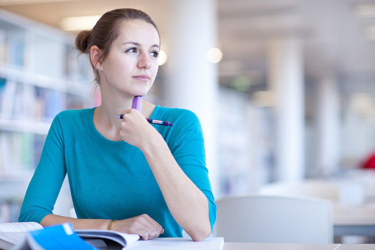 Bachelor's in Psychology student studying in the library.