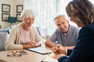 Geriatric social work meeting with elderly couple in their home