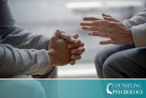 A close-up of the hands of a mental health counselor and a patient.