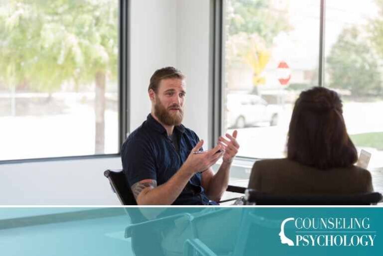 A psychology degree graduate furthers his career by doing some clinical work with a patient.