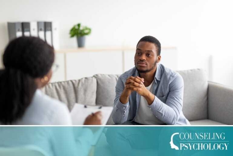 A mental health counselor sits with a patient in her office.